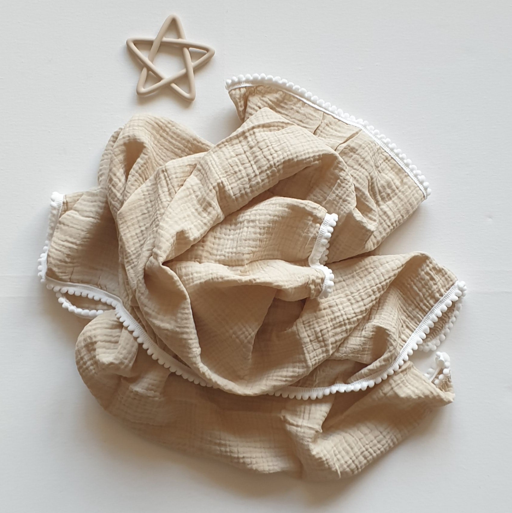 Hydrofiele doek met pomponnetjes